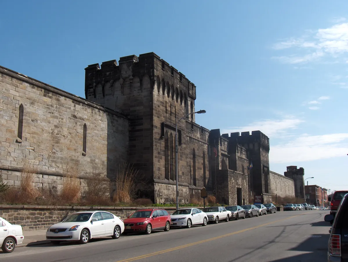 The stone south wall of Eastern State Penitentiary along Fairmount Avenue