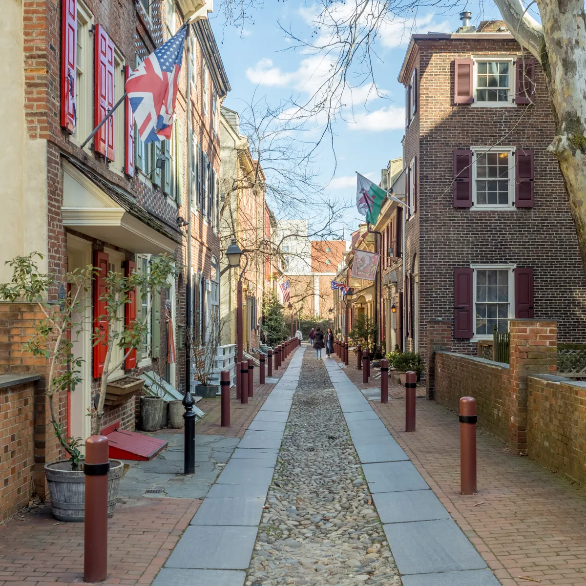 Historic brick houses and a cobblestone lane along Elfreth's Alley in Philadelphia