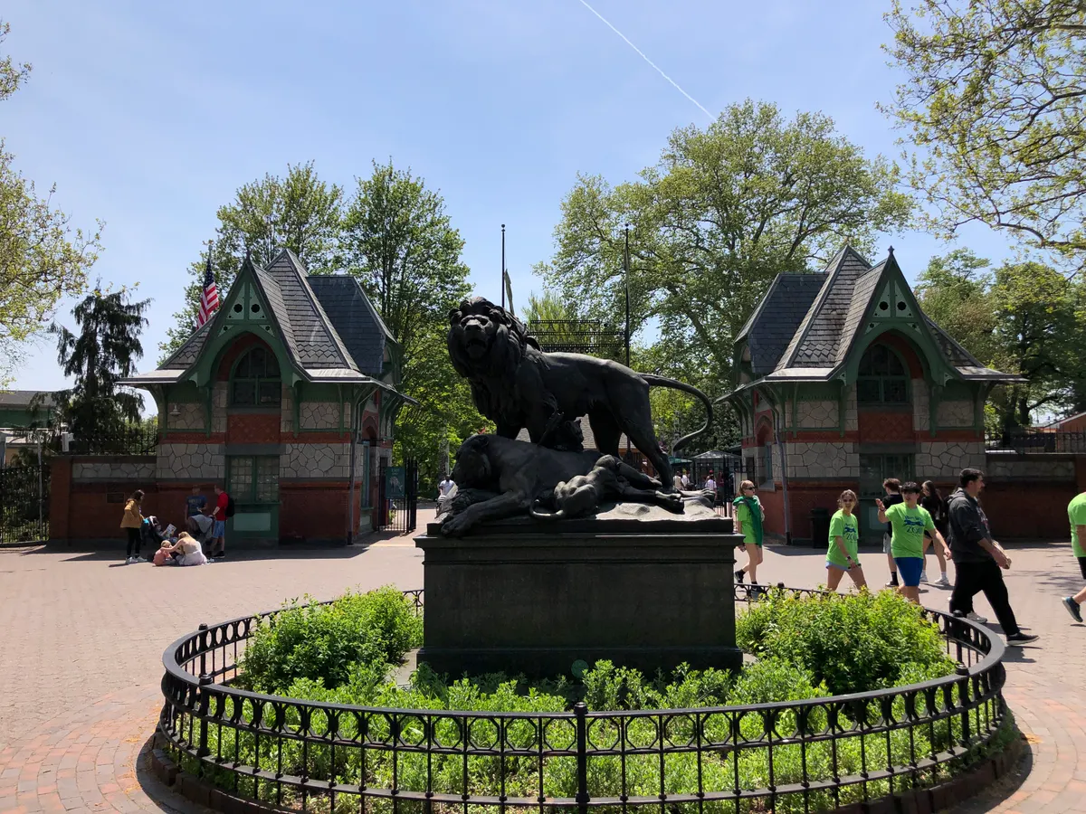 The lion statue and gates at the main entrance to Philadelphia Zoo