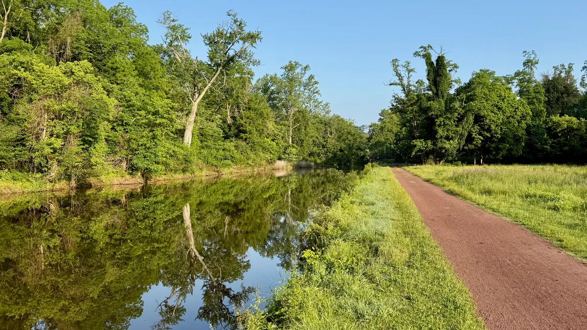 The Delaware Canal beside its towpath and green vegetation in Solebury Township