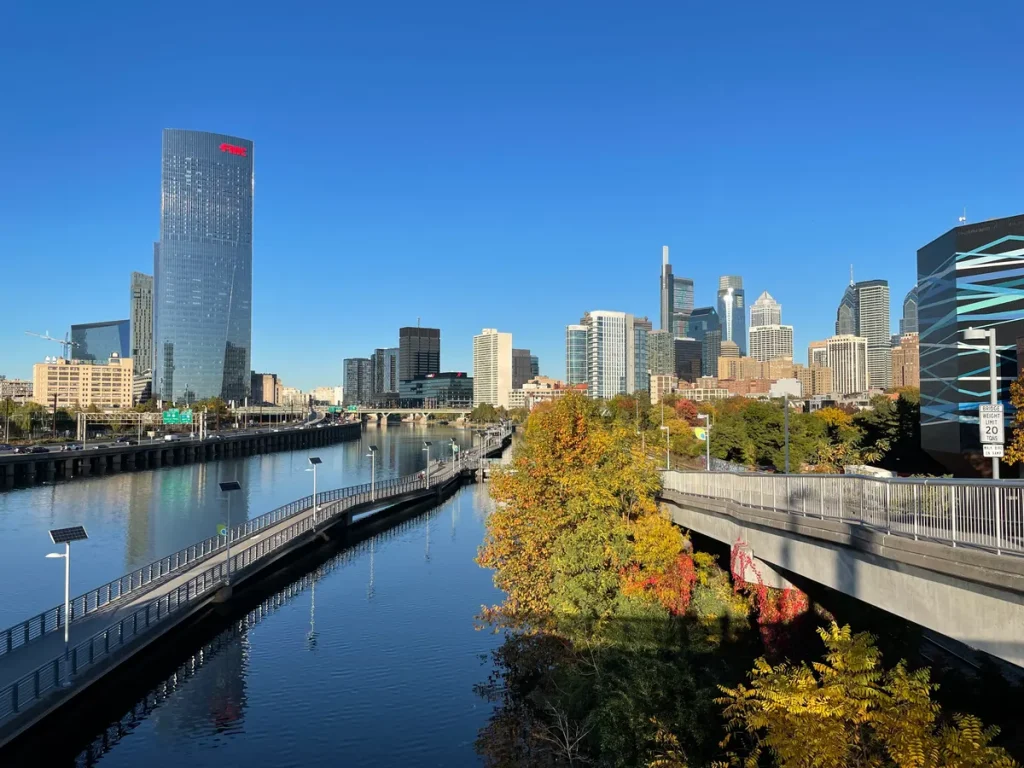 The Schuylkill River Trail beside the river, with bridges and the Philadelphia skyline beyond